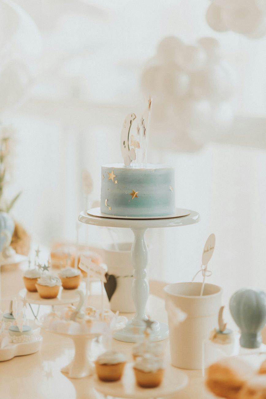A dreamy baby shower cake with gold stars
